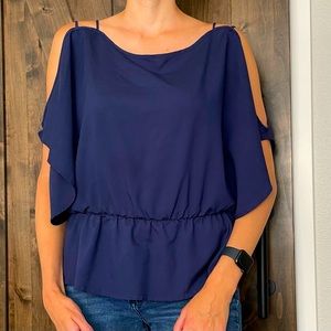 Navy blue, cut out blouse. Great material and such a cute top!